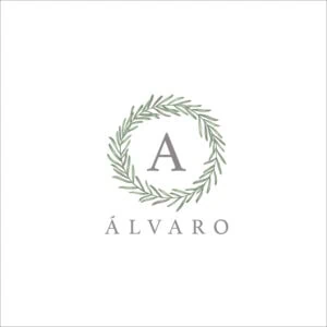 1. Logo de Álbumes personalizados con hojas de laurel y letra A en estilo elegante.