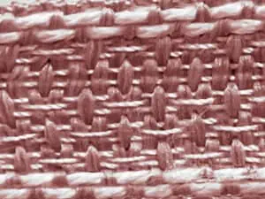 1. Muestra un tejido de punto en color rosa con textura detallada y resistencia.