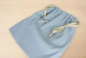 Alto: Álbumes de 3F en colores pastel con cierre de cuerda para recuerdos únicos.